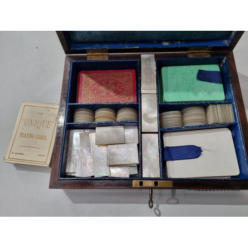 53 - A 19th century rosewood Games Box with mother of pearl inlay to the lid depicting playing cards, con... 