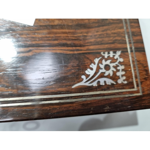 53 - A 19th century rosewood Games Box with mother of pearl inlay to the lid depicting playing cards, con... 
