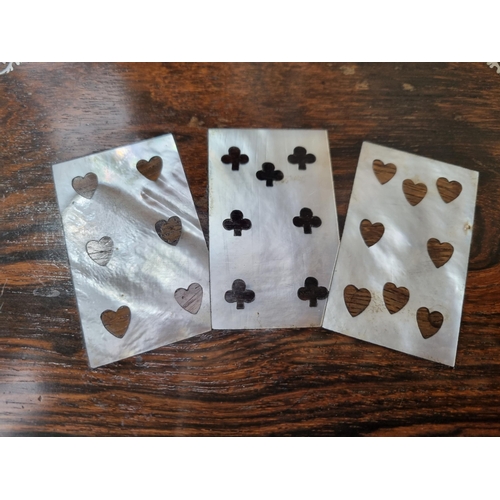 53 - A 19th century rosewood Games Box with mother of pearl inlay to the lid depicting playing cards, con... 