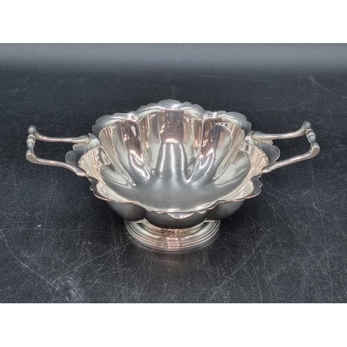 127 - An Edward VII silver two handled Bowl of lobed form on pedestal base, London 1908, 190gms