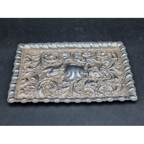 128 - An Edward VII silver Dressing Table Tray with bird and scroll embossing, Birmingham 1906, 295gms