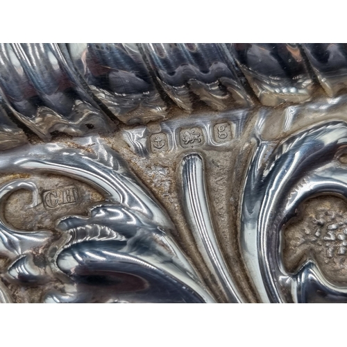 128 - An Edward VII silver Dressing Table Tray with bird and scroll embossing, Birmingham 1906, 295gms