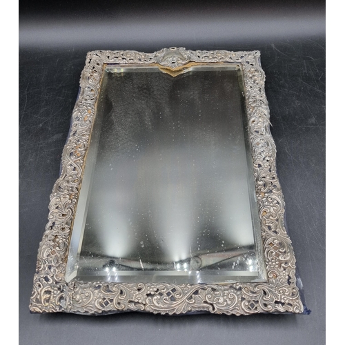130 - A Victorian silver framed Easel Mirror with scroll embossing and piercing, Birmingham 1898, 14 x 9in