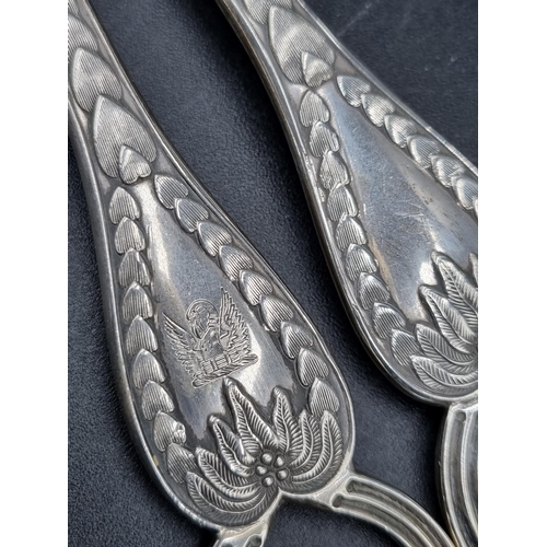 137 - A pair of George V silver Grape Scissors with leafage engraving and crest, London 1923, maker: Golds... 