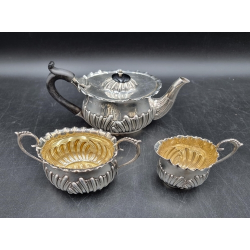 139 - A Victorian silver three piece Tea Service of oval  gadroon form, Birmingham 1894/5, 350gms all in