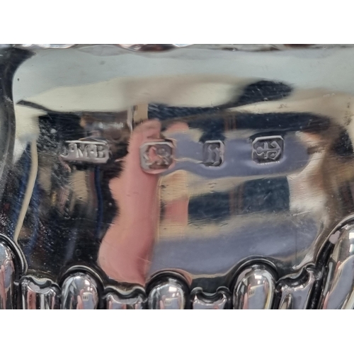 139 - A Victorian silver three piece Tea Service of oval  gadroon form, Birmingham 1894/5, 350gms all in