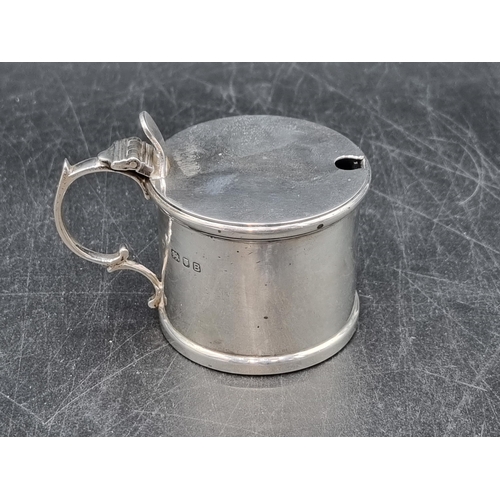 141 - A George VI silver drum Mustard Pot with blue glass liner, London 1937