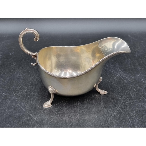 143 - A George V silver Sauce Boat with scroll handle on hoof feet, London 1911, Asprey & Co, Ltd, 170gms