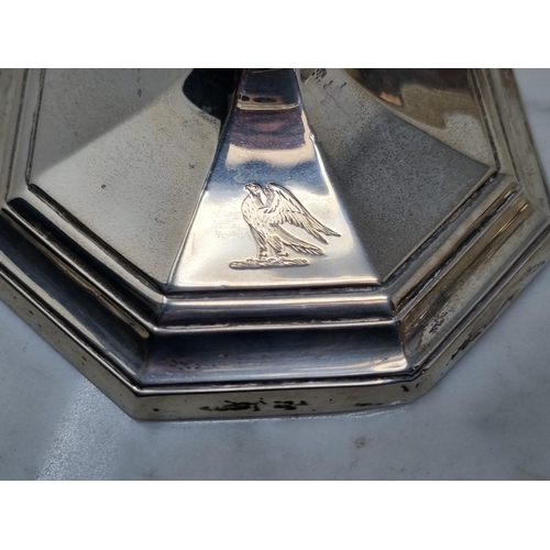 146 - A pair of Victorian silver Candlesticks with baluster stems on octagonal bases engraved eagle crests... 