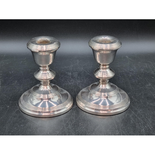 147 - A pair of Elizabeth II silver Candlesticks on reeded circular bases, Birmingham 1971, 5in
