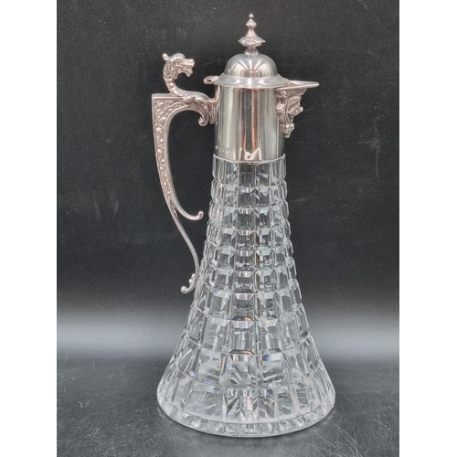 149 - An Elizabeth II silver mounted glass Claret Jug with ornate spout, griffin handle, Sheffield 1973, m... 