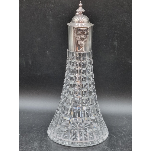 149 - An Elizabeth II silver mounted glass Claret Jug with ornate spout, griffin handle, Sheffield 1973, m... 