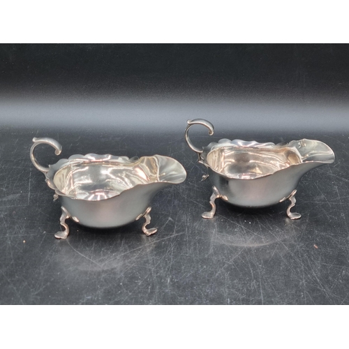 157 - A pair of George V silver Sauce Boats with scroll handles on shaped feet, Sheffield 1913, 240gms