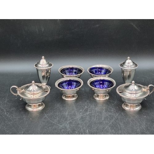 158 - A George V silver eight piece Condiment Set of circular form, Sheffield 1912/13, viz: four Salts, tw... 