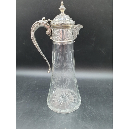 168 - A Victorian silver mounted cut glass Claret Jug etched ribbons and floral swags, London 1888, 12in