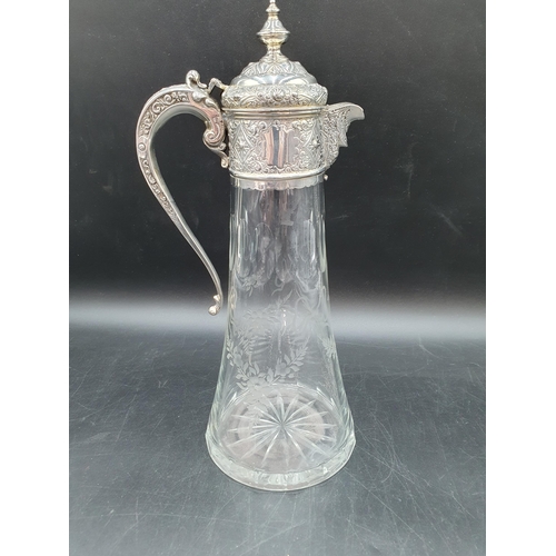 168 - A Victorian silver mounted cut glass Claret Jug etched ribbons and floral swags, London 1888, 12in
