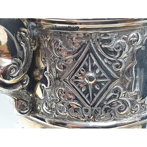 168 - A Victorian silver mounted cut glass Claret Jug etched ribbons and floral swags, London 1888, 12in