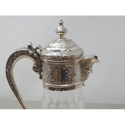 168 - A Victorian silver mounted cut glass Claret Jug etched ribbons and floral swags, London 1888, 12in