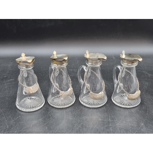 172 - Four George V silver lidded glass Toddy Flasks, Birmingham 1931 &  1934, plus four Whisky Labels, on... 