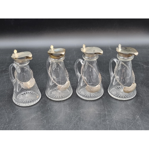 172 - Four George V silver lidded glass Toddy Flasks, Birmingham 1931 &  1934, plus four Whisky Labels, on... 
