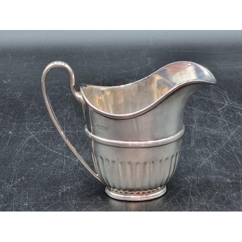 173 - A George V silver oval semi-fluted Milk Jug, Sheffield 1912, 170gms