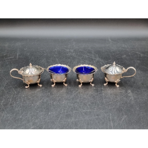 174 - Two George V silver Salts and Mustard Pots, Birmingham 1928/30, two Condiment Spoons