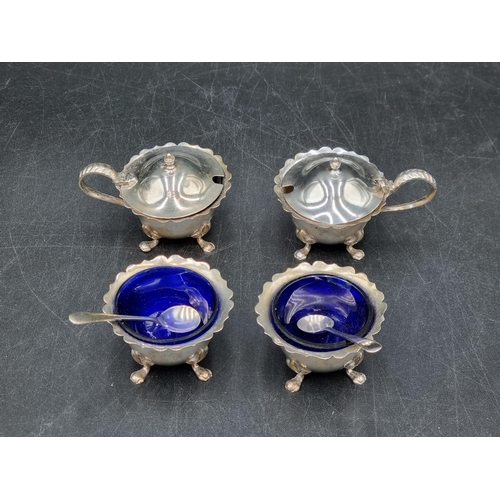 174 - Two George V silver Salts and Mustard Pots, Birmingham 1928/30, two Condiment Spoons
