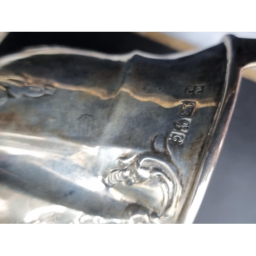 176 - A George III silver oval Milk Jug with engraved friezes and initials, London 1809, A/F, and an Edwar... 