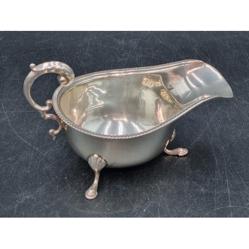 179 - A George VI silver Sauce Boat with leafage scroll handle on hoof feet, Birmingham 1937?, 90gms