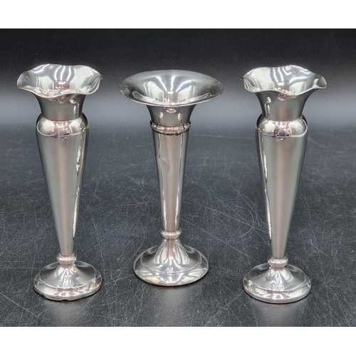 180 - A pair of George V silver Posy Vases, Birmingham 1914, 5 1/2in, and another, Chester 1906