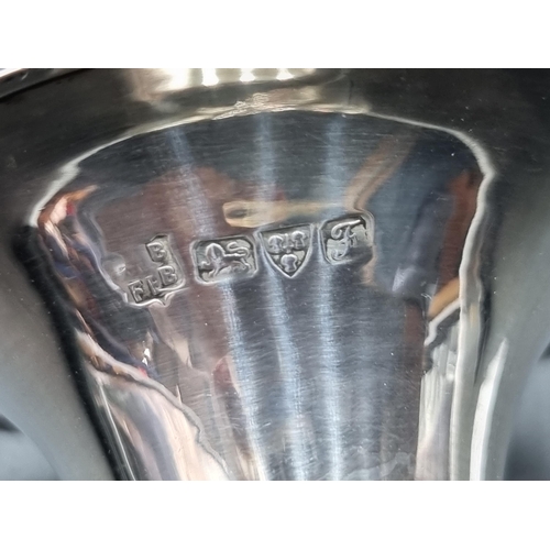 180 - A pair of George V silver Posy Vases, Birmingham 1914, 5 1/2in, and another, Chester 1906