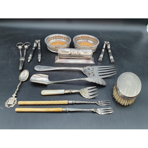 197 - A silver mounted Brush, a plated cased Calendar, pair of Bottle Coasters, Stilton Scoop, Pickle Fork... 