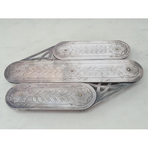 206 - An unusual silver plated Extending Table Coaster with floral and leafage decoration on seven swivel ... 