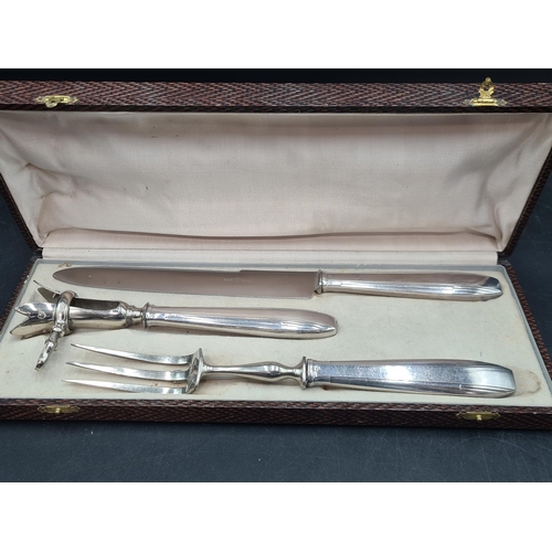 208 - A plated Ham Handle, Carving Knife and Fork, in case