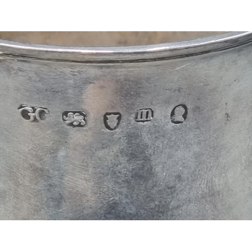 212 - A George III silver Pint Mug having scroll handle with heart shape finial, engraved initials S over ... 