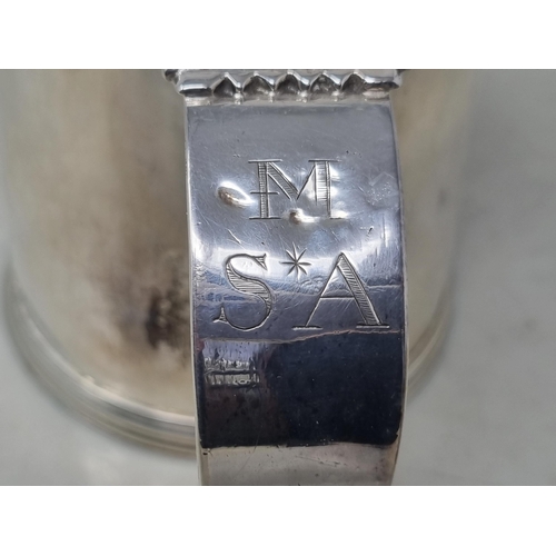 216 - A William & Mary silver Tankard with flat cover, vollute thumb piece, scroll handle engraved initial... 