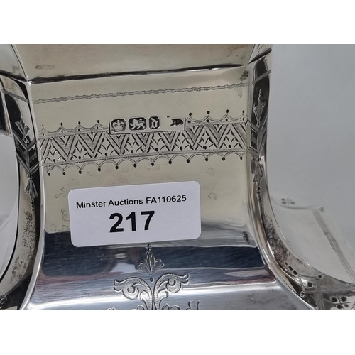 217 - A Victorian silver four piece Tea & Coffee Service of shaped oblong form with finely engraved frieze... 