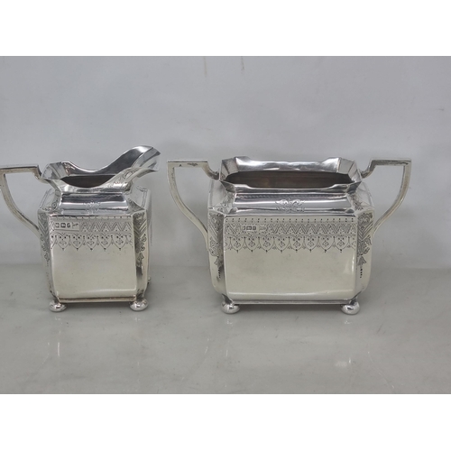 217 - A Victorian silver four piece Tea & Coffee Service of shaped oblong form with finely engraved frieze... 