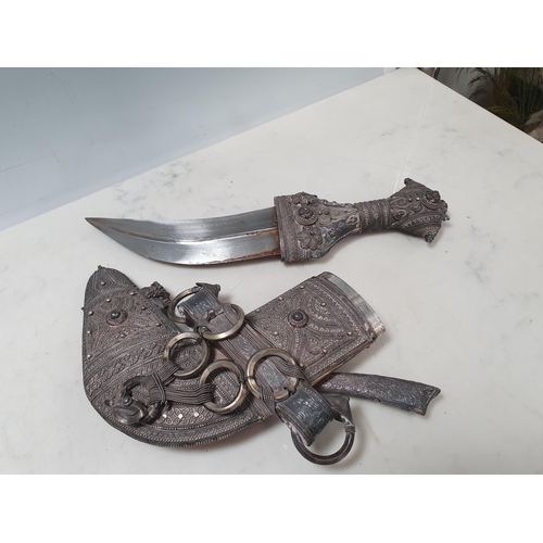221 - A Middle Eastern Omani Jambiya Dagger with white metal mounted scabbard and hilt, with associated sm... 