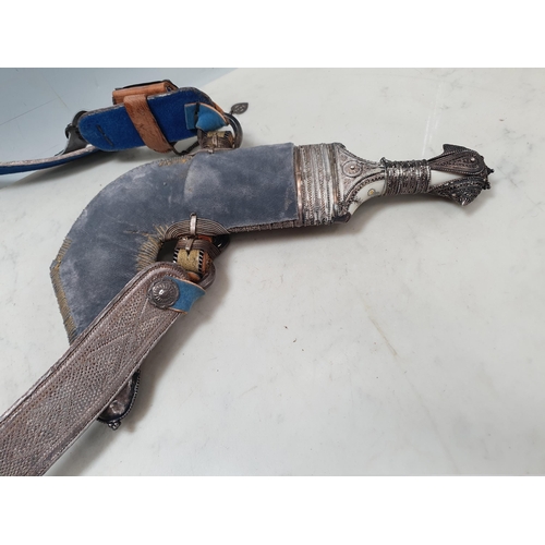 222 - A Middle eastern Omani Jambiya Dagger with part white metal mounted scabbard and hilt, on associated... 