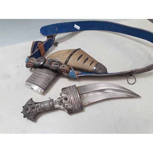 222 - A Middle eastern Omani Jambiya Dagger with part white metal mounted scabbard and hilt, on associated... 