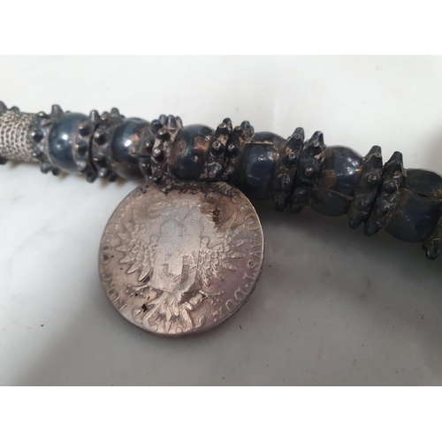 224 - A Middle eastern white metal Dowry Necklace mounted with four re-strike Austria Maria Theresa silver... 