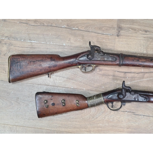 996 - Two 19th Century Percussion Muskets, both showing evidence of tribal ownership 43in and 52in L overa... 