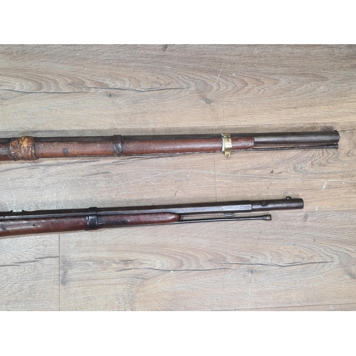 996 - Two 19th Century Percussion Muskets, both showing evidence of tribal ownership 43in and 52in L overa... 