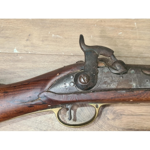 996 - Two 19th Century Percussion Muskets, both showing evidence of tribal ownership 43in and 52in L overa... 