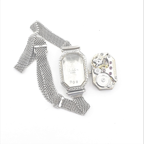251 - An Art Deco lady's Wristwatch by Gübelin, the white metal elongated octagonal case having silvered d... 