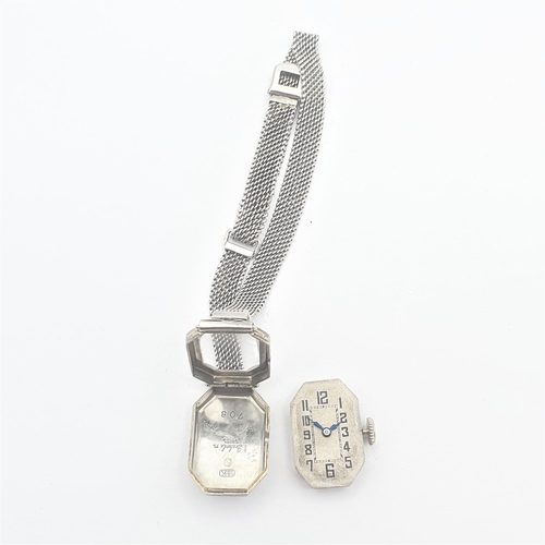 251 - An Art Deco lady's Wristwatch by Gübelin, the white metal elongated octagonal case having silvered d... 