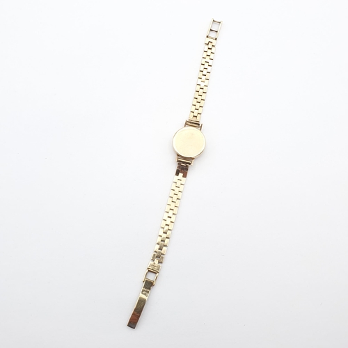 258 - A lady's Zenith Wristwatch, the round cream dial with Arabic numerals at quarters the remainder bato... 