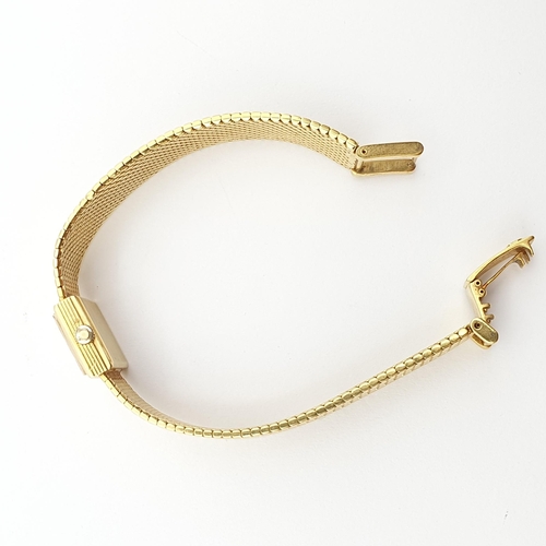 252 - A lady's Omega manual-wind Wristwatch the square champagne dial with baton markers on integral 18ct ... 