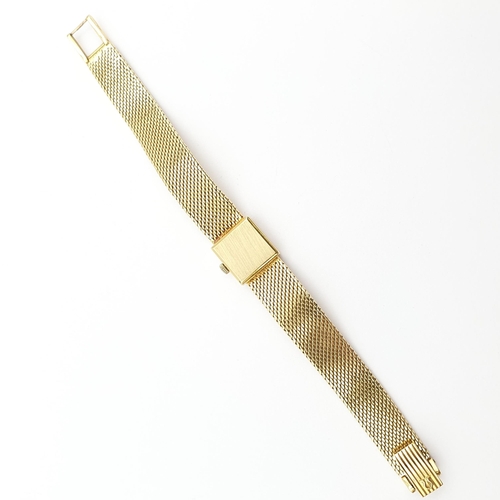 252 - A lady's Omega manual-wind Wristwatch the square champagne dial with baton markers on integral 18ct ... 